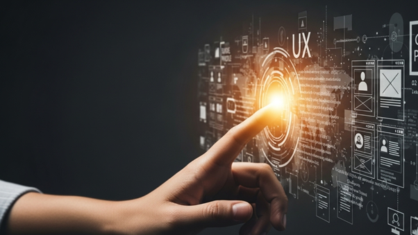 A hand pointing to a glowing digital interface displaying the term 'UX' surrounded by data and wireframe elements, symbolizing design focus.
